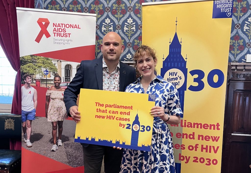 Terrence Higgins Trust CEO Richard Angell and Shadow Health Secretary Victoria Atkins smiling holding a 2030 campaign card.