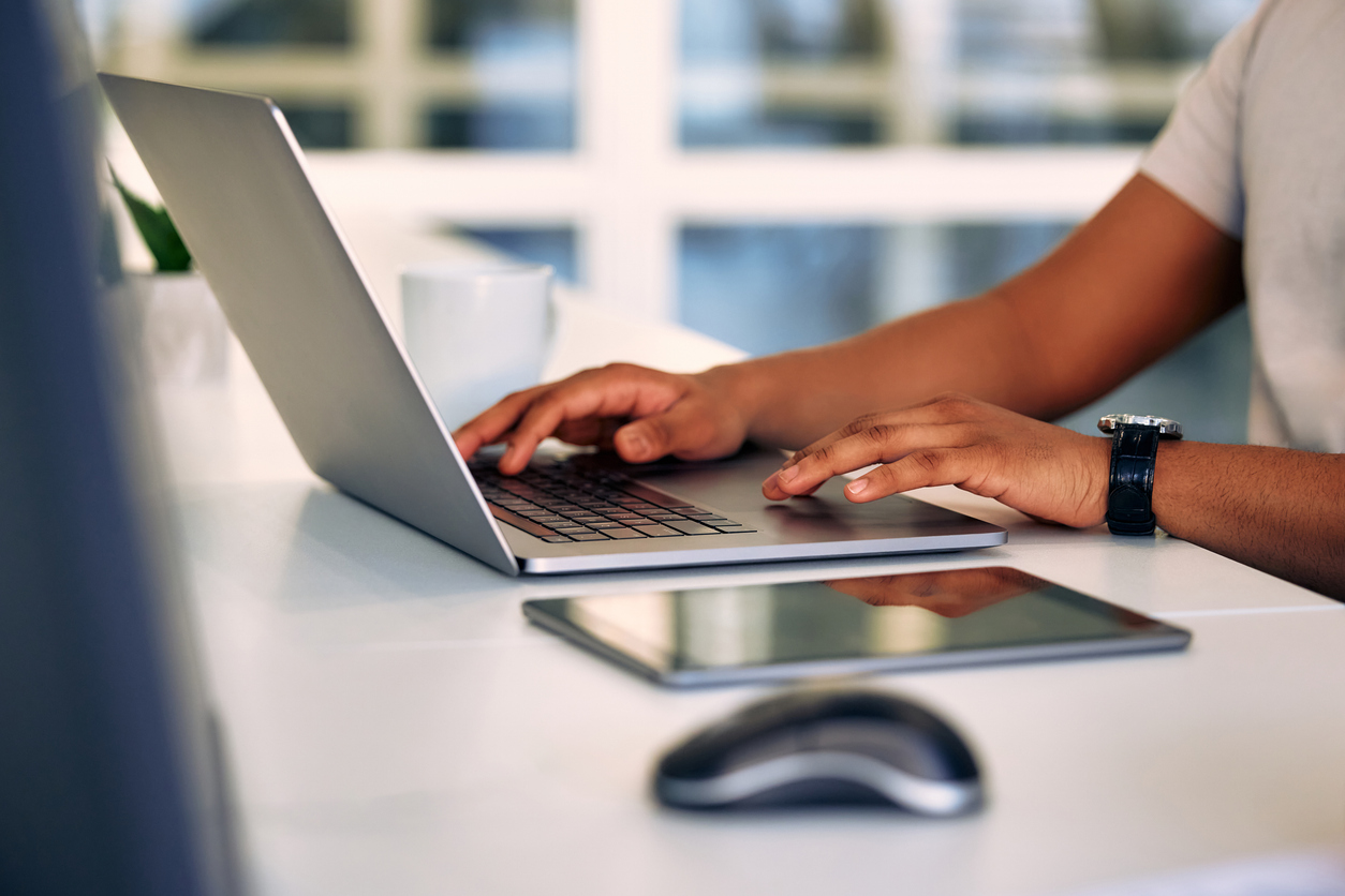 Hands at a laptop.