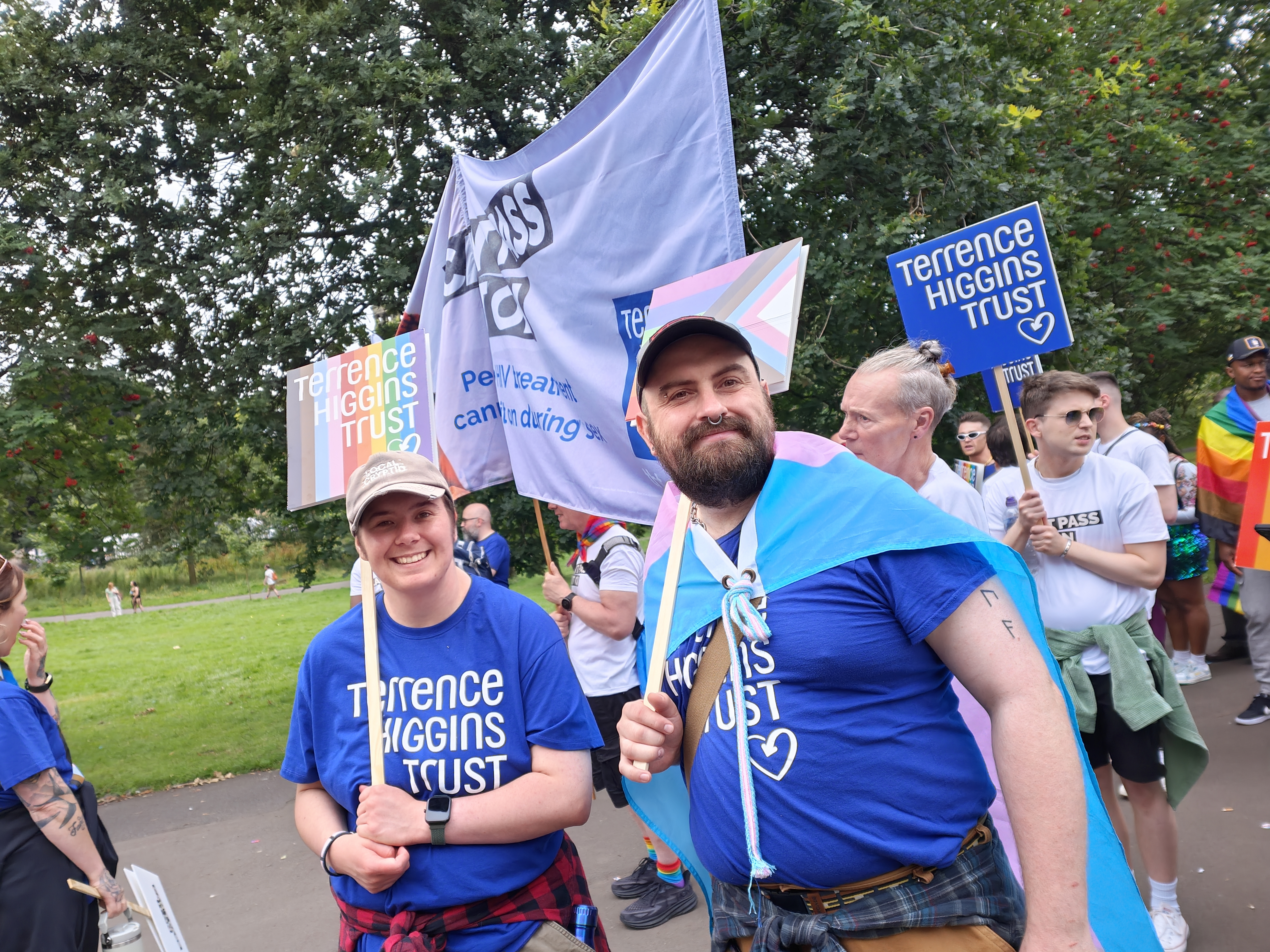 Two Terrence Higgins Trust supporters at Pride.